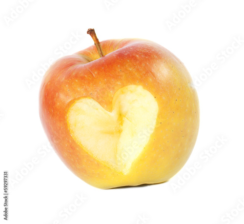 yellow apple with a carved heart