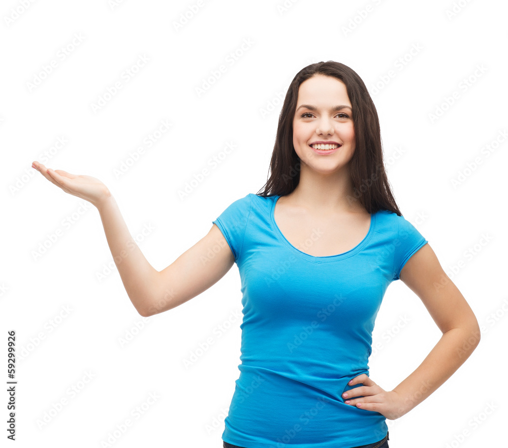 teenager holding something on the palm of her hand teenager holding something on the palm of her hand