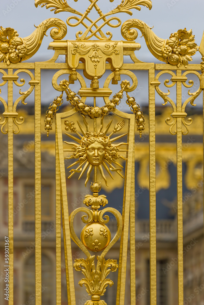 Golden ornate gate of Chateau de Versailles