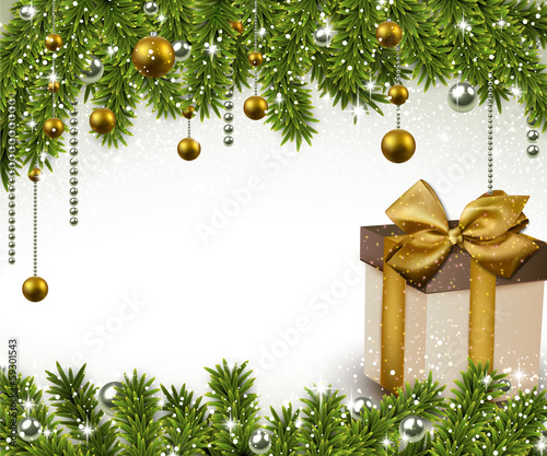 Christmas background with fir branches and gift box.