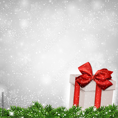 Christmas background with fir branches gift box.