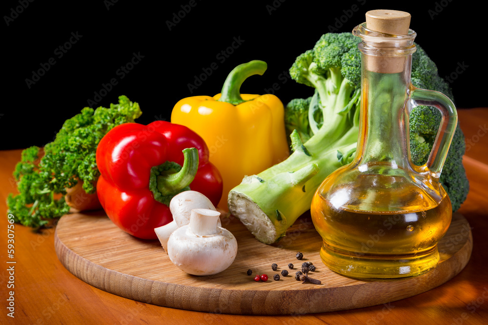 fresh vegetables with oil on cutting board fresh vegetables with oil on cutting board