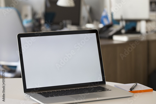Laptop on a desk in the office