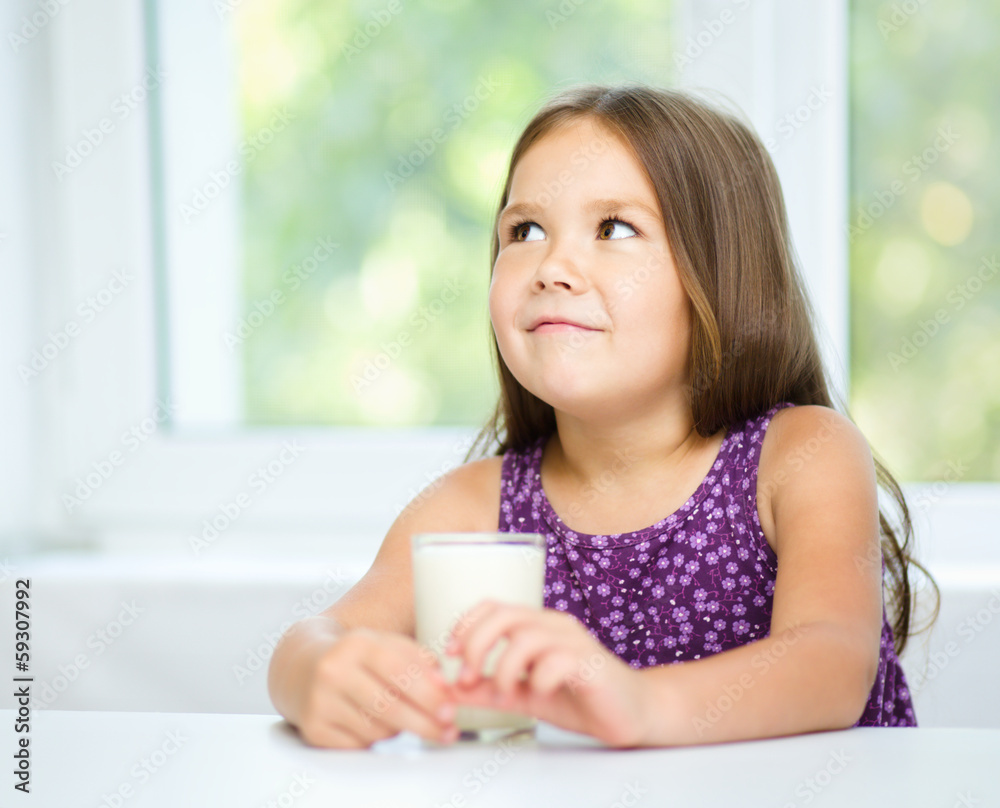 Cute little girl with a glass of milk Cute little girl with a glass of milk