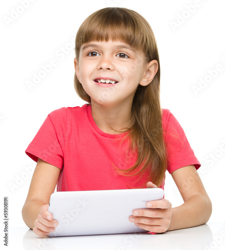 Young girl is using tablet © Serhiy Kobyakov