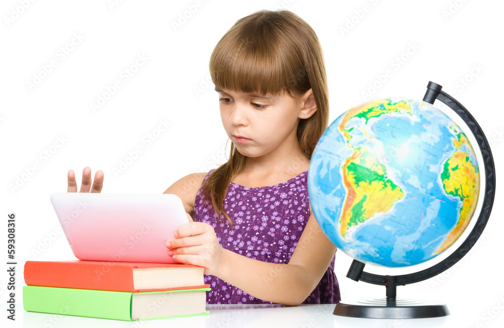 Young girl is using tablet