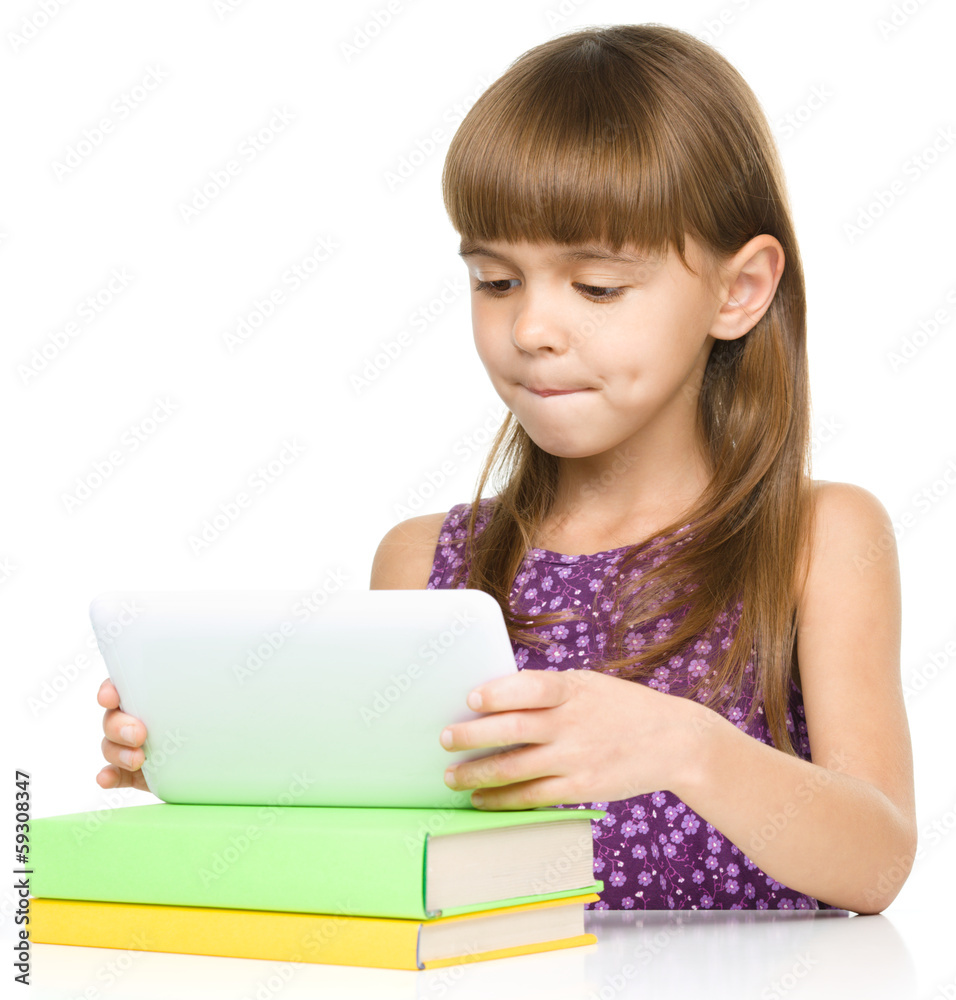 Young girl is using tablet