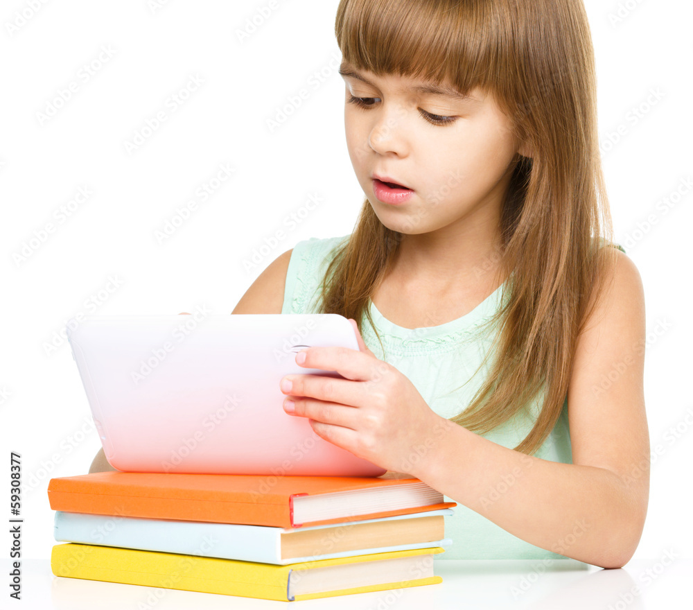 Young girl is using tablet