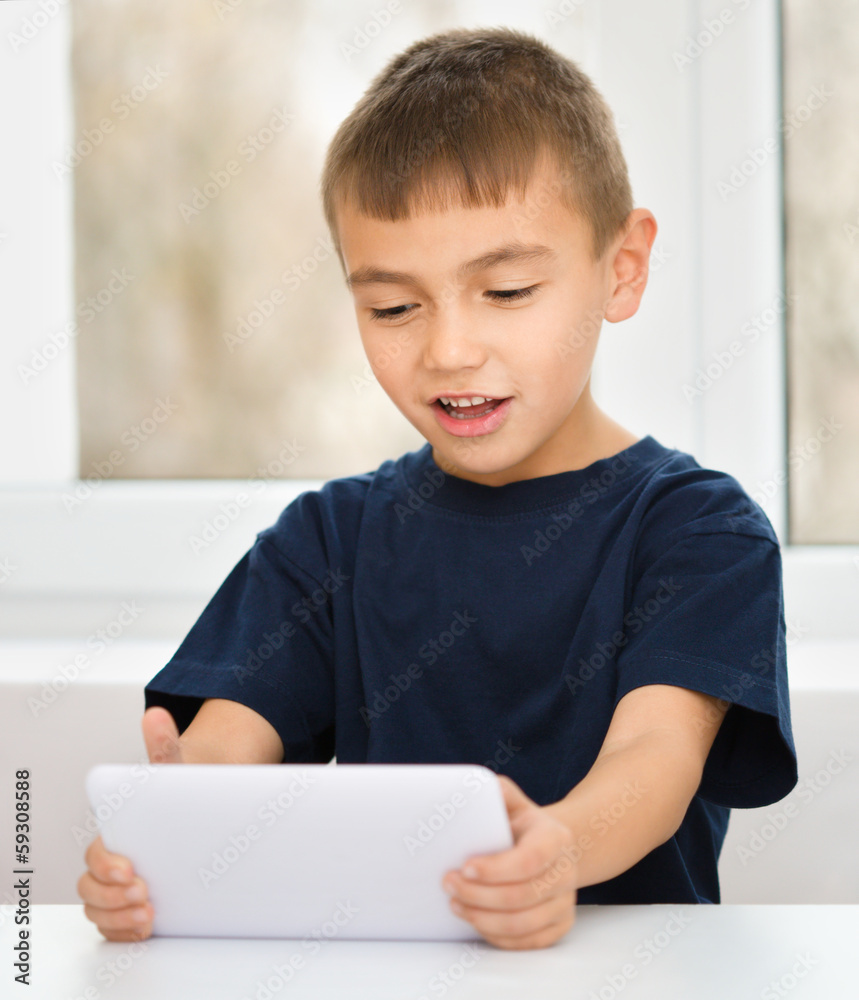 Young boy is using tablet Young boy is using tablet