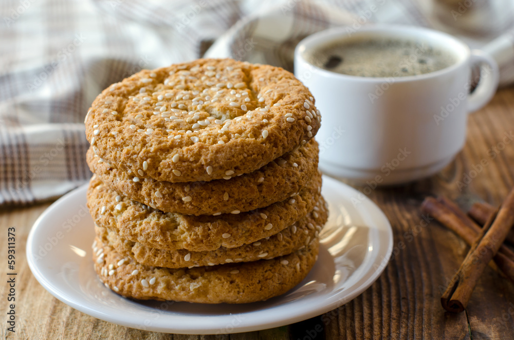 Cookies on a wooden table with a cup of coffee Cookies on a wooden table with a cup of coffee