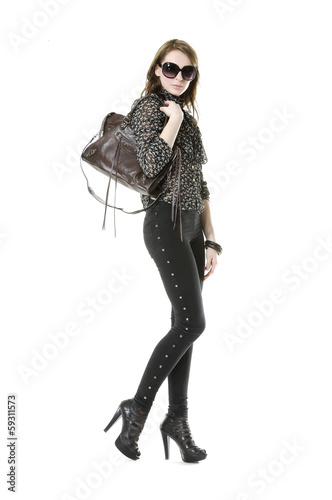 Urban fashion girl with modern bag. Isolated