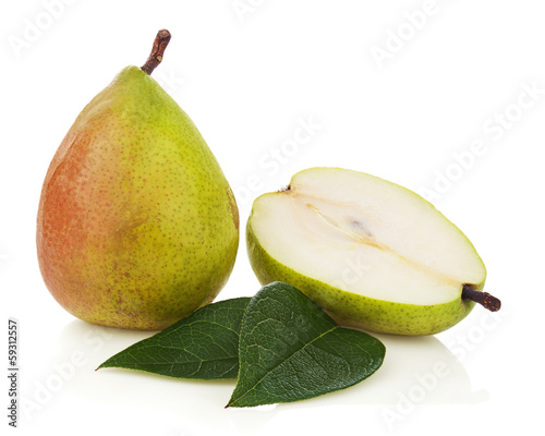 Ripe pear with cut and green leaves isolated on white background