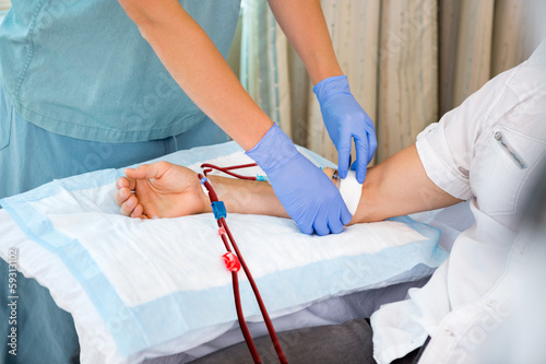 Photos Nurse Starting Dialysis on Patient