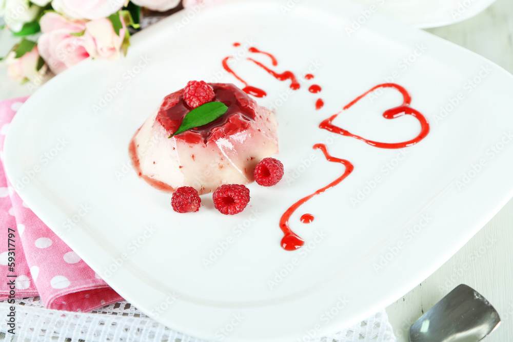 Panna Cotta with raspberry sauce, on wooden background Panna Cotta with raspberry sauce, on wooden background