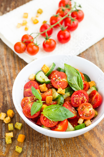 Tomato salad with cucumber and croutons