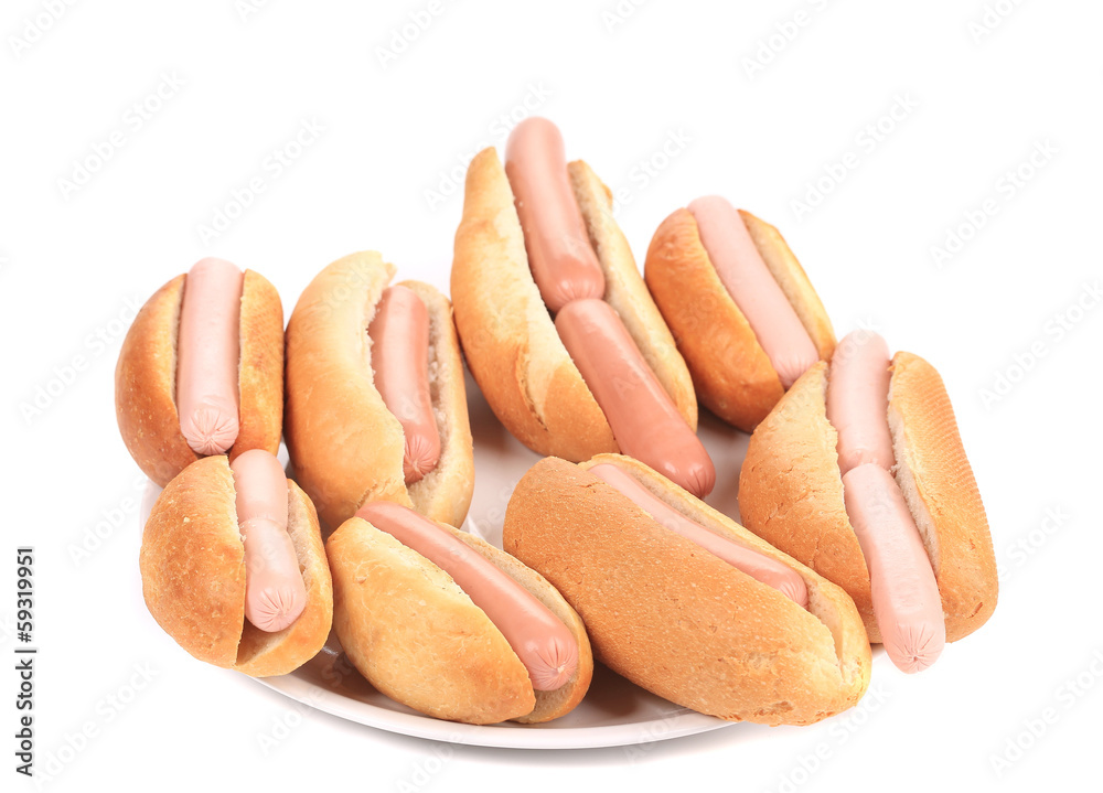 Bunch of hotdogs on plate. Bunch of hotdogs on plate.