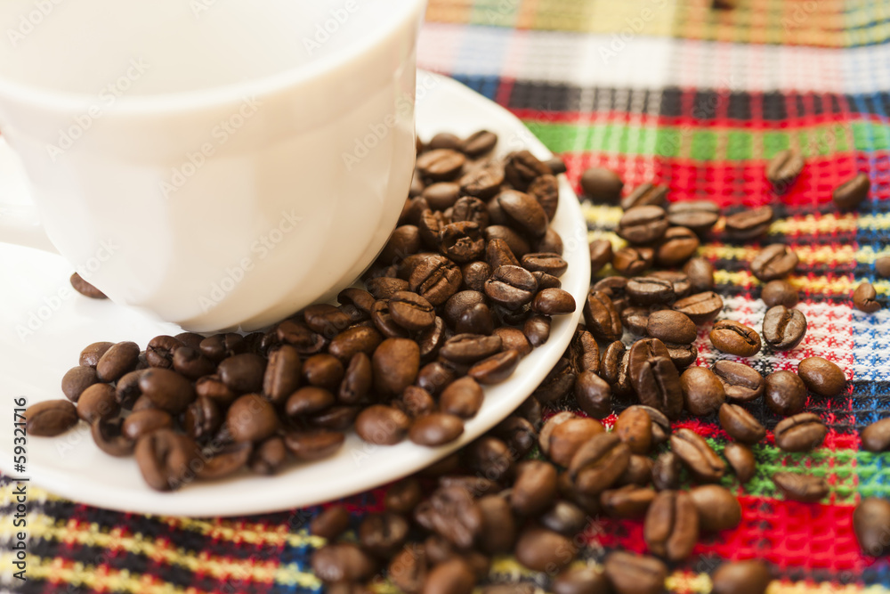 Fototapeta premium Coffee grains on a table