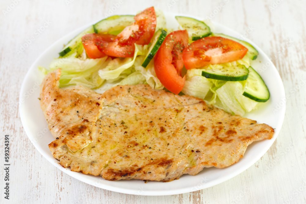 fried turkey with salad on plate fried turkey with salad on plate