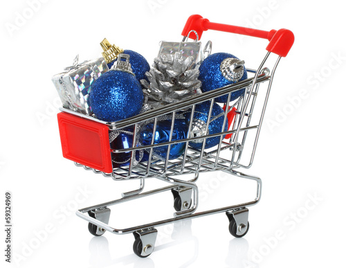 Shopping cart with Christmas gifts on white background.