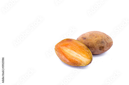 Sapodilla or chiku fruits over white background