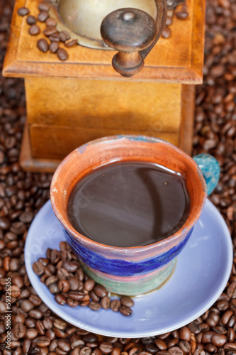 cup of coffee and roasted beans