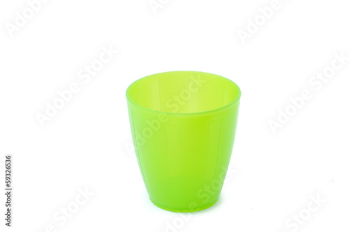 Green plastic cup isolated on white