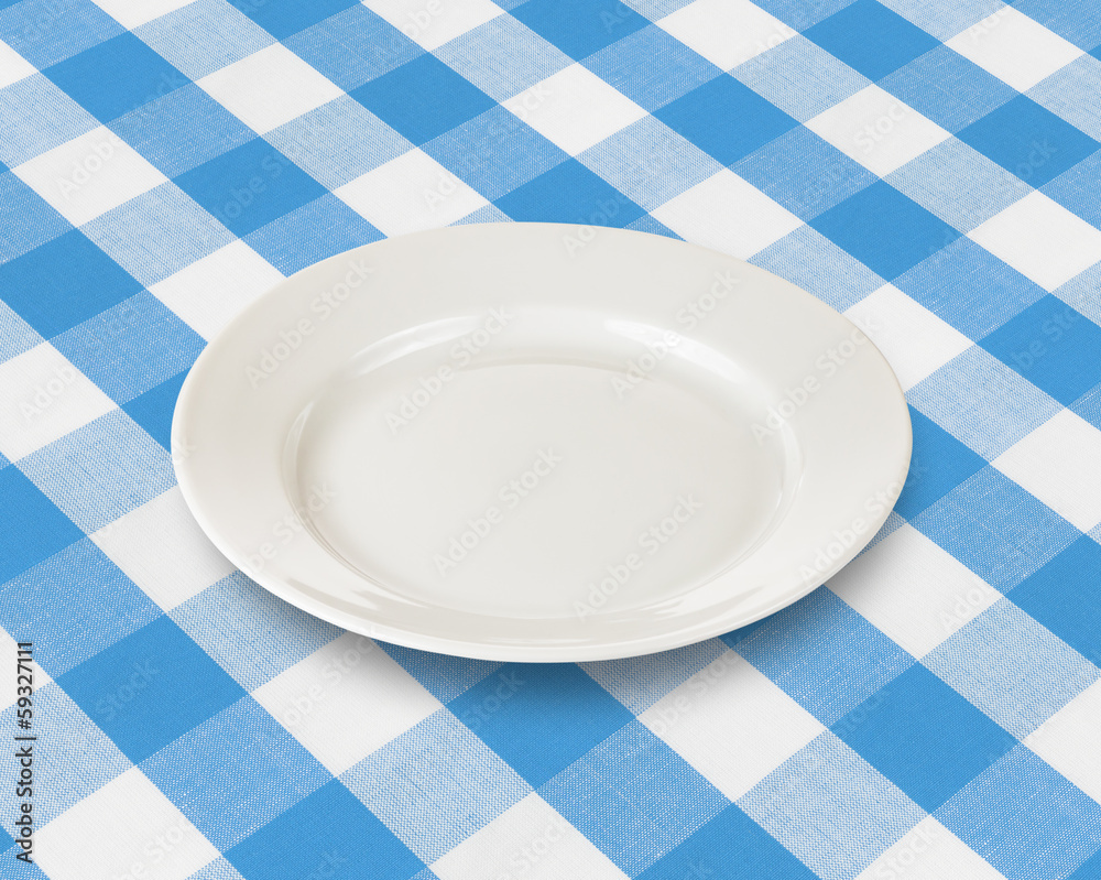 plate or dish over blue checked fabric tablecloth plate or dish over blue checked fabric tablecloth