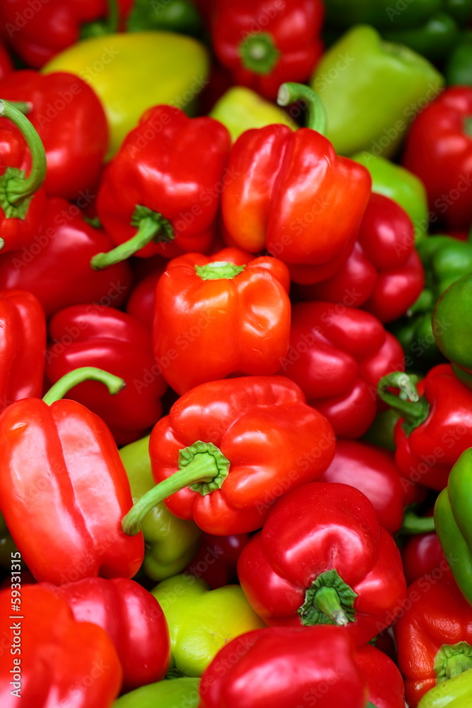 Red, green and yellow sweet bell peppers natural background. Red, green and yellow sweet bell peppers natural background.