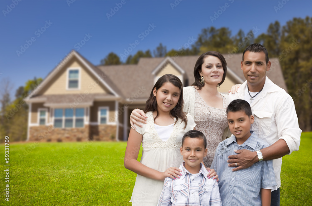 Young Hispanic Family in Front of Their New Home Young Hispanic Family in Front of Their New Home