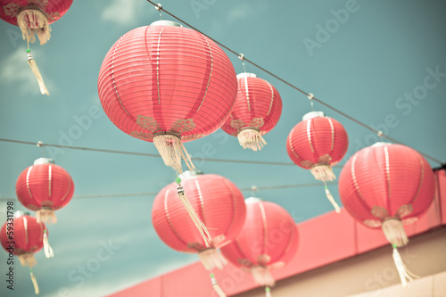 Red Chinese Paper Lanterns against a Blue Sky photo