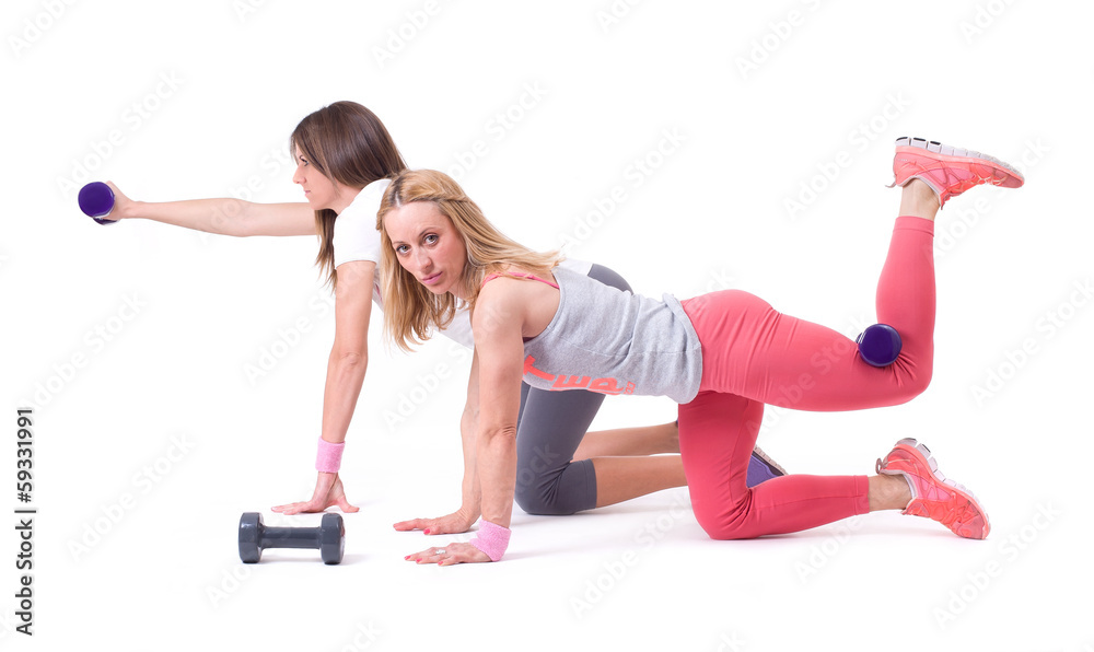 Two sport woman exercise with dumbbells