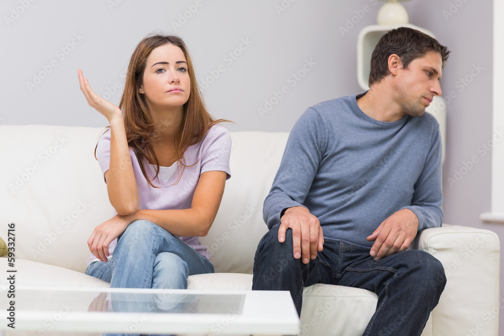 Unhappy couple not talking after argument at home