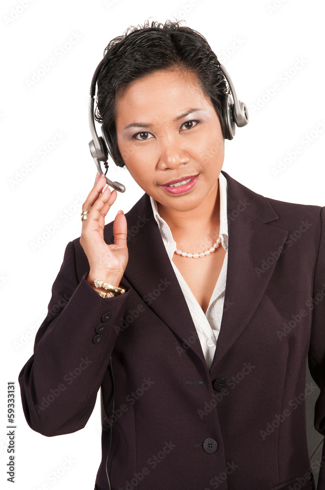 Friendly beautiful asian women with headphone at the hotline Friendly beautiful asian women with headphone at the hotline