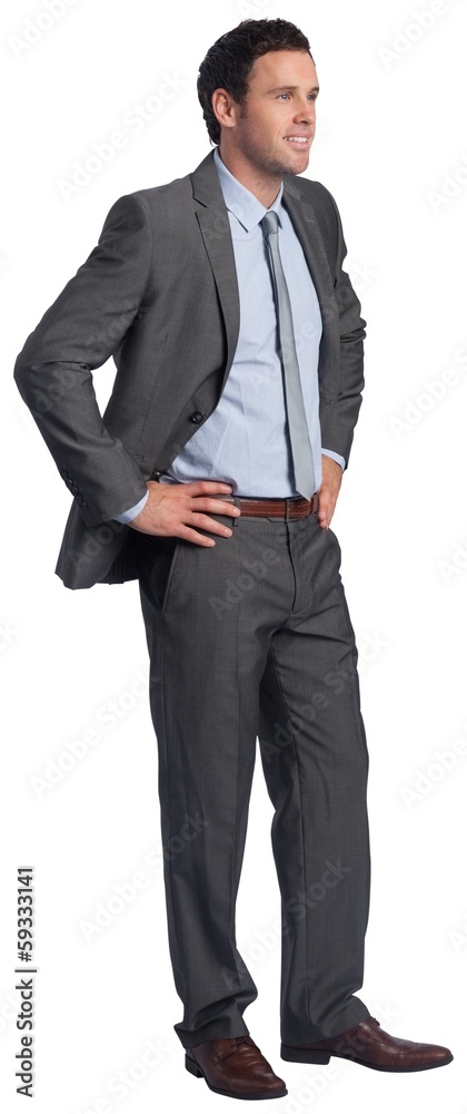 Smiling businessman with hands on hips Smiling businessman with hands on hips