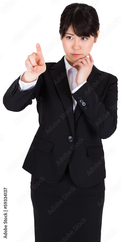 Thoughtful businesswoman pointing Thoughtful businesswoman pointing