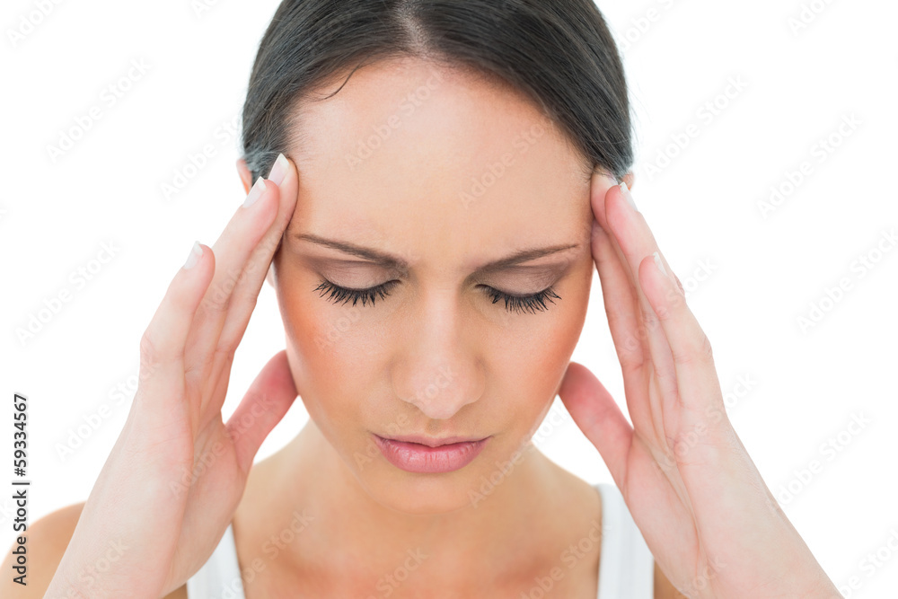 Close-up of a casual woman suffering from headache Close-up of a casual woman suffering from headache