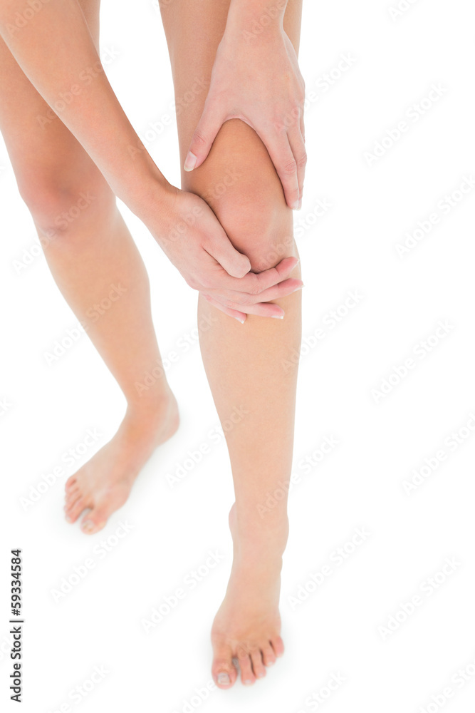 Close-up low section of a fit woman with leg pain Close-up low section of a fit woman with leg pain