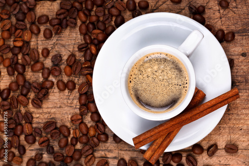 Cup of coffee with cinnamon rolls