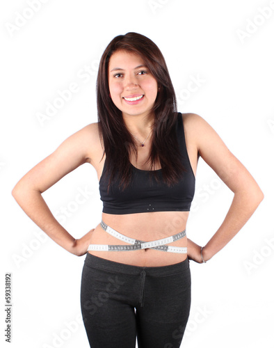 young woman measuring her waist © javy