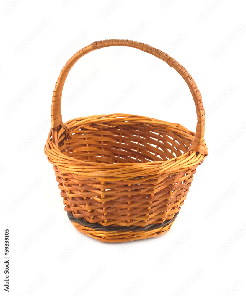 Small empty brown wicker basket isolated on white closeup Small empty brown wicker basket isolated on white closeup