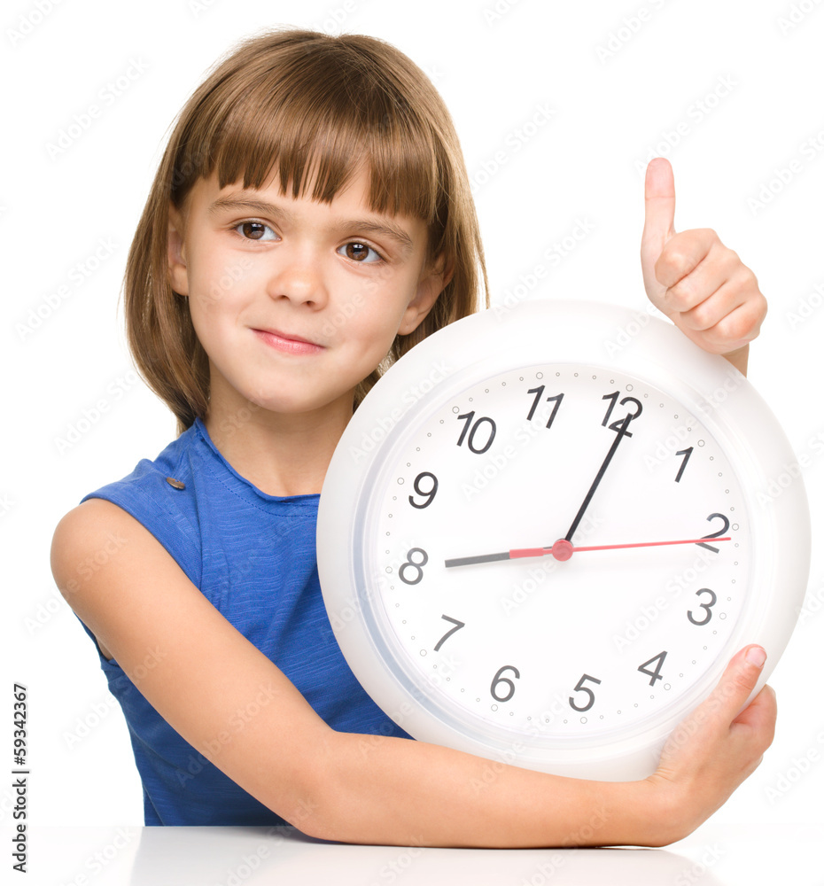 Little girl is holding big clock Little girl is holding big clock