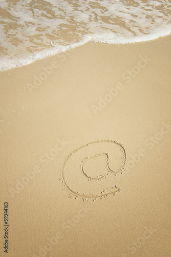 Email symbol draw on beach