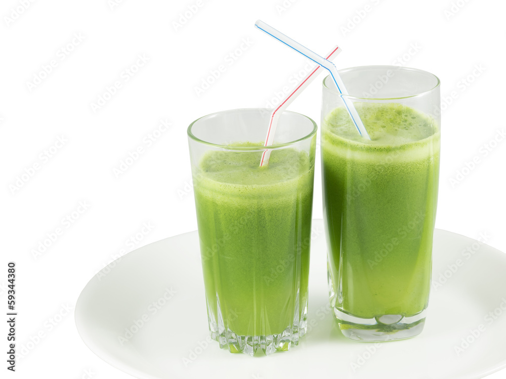 Green vegetable juice in the glasses with straws Green vegetable juice in the glasses with straws