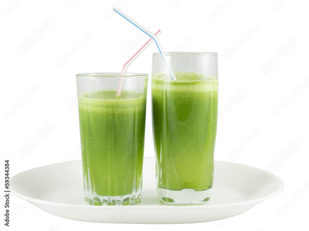 Green vegetable juice in the glasses with straws Green vegetable juice in the glasses with straws