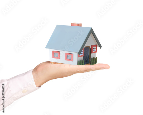 holding house representing home ownership