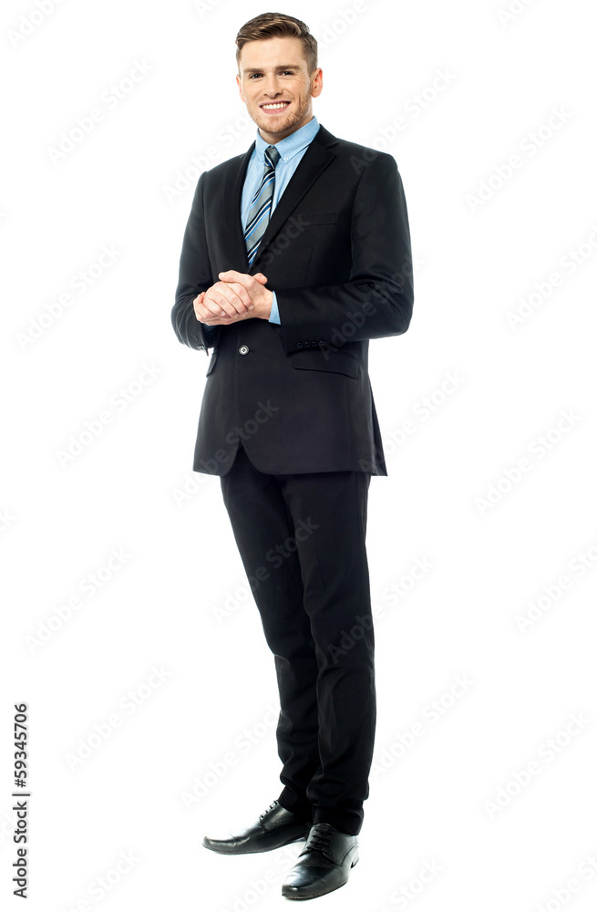 Corporate guy posing with clasped hands Corporate guy posing with clasped hands