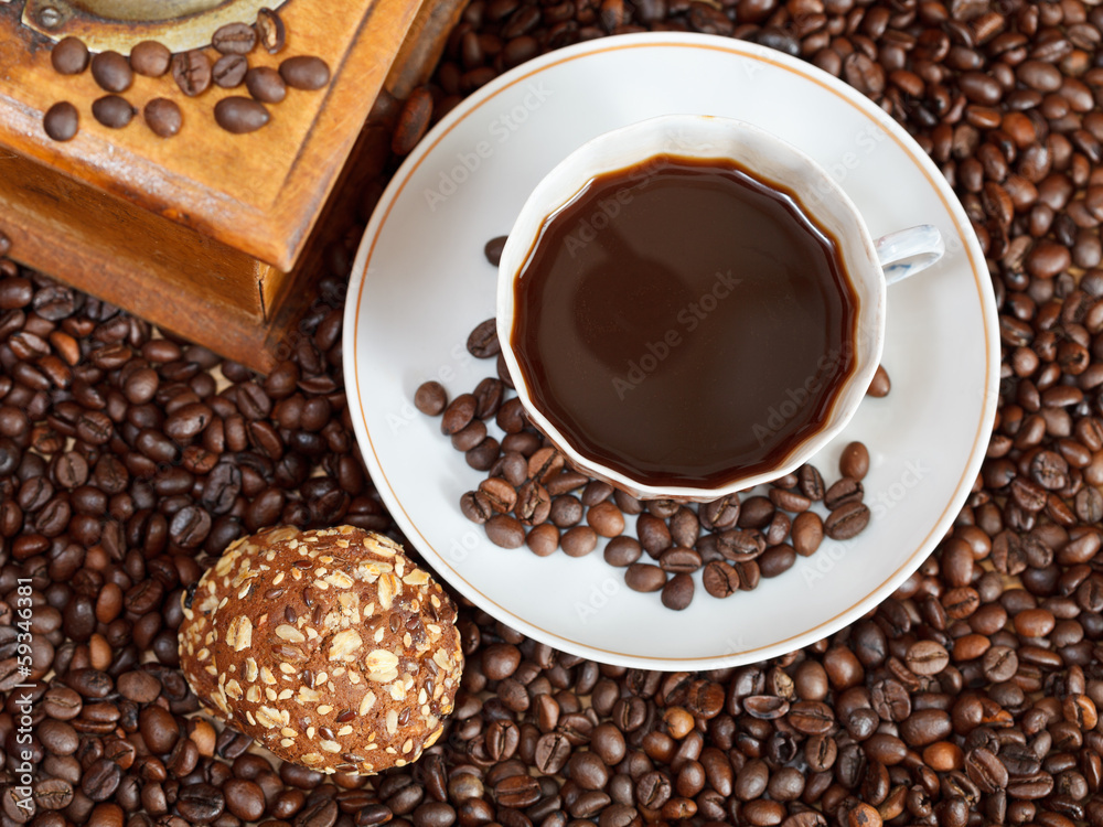 Fototapeta premium cup of coffee and roasted beans