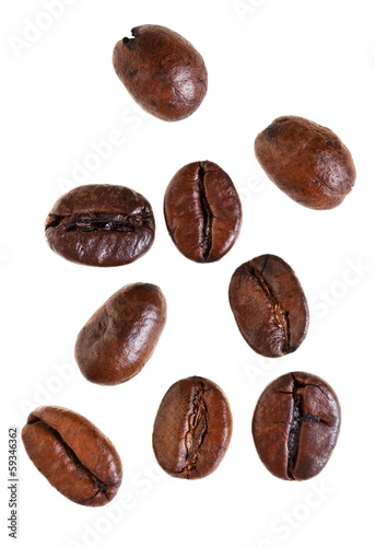 several falling roasted coffee beans