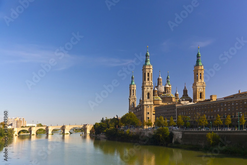 Basilica del Pilar in a bright sunny day on a background of blue