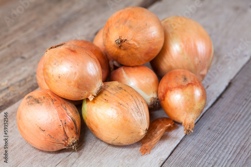 Onions on a wooden background